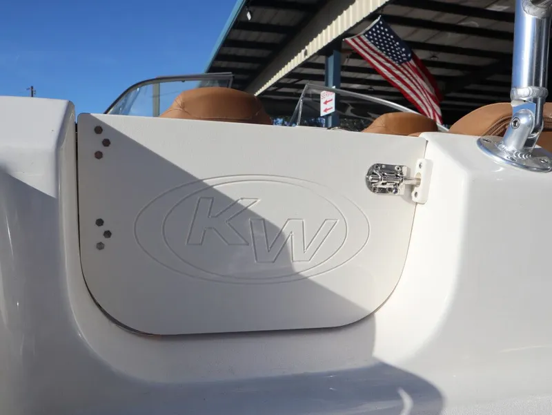 Slide: The Image of Key West 203 DFS boat with American flag in background. - 17