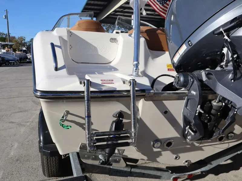 Slide: The Image of Rear view of a 2026 Key West 203 DFS boat with outboard motor. - 18