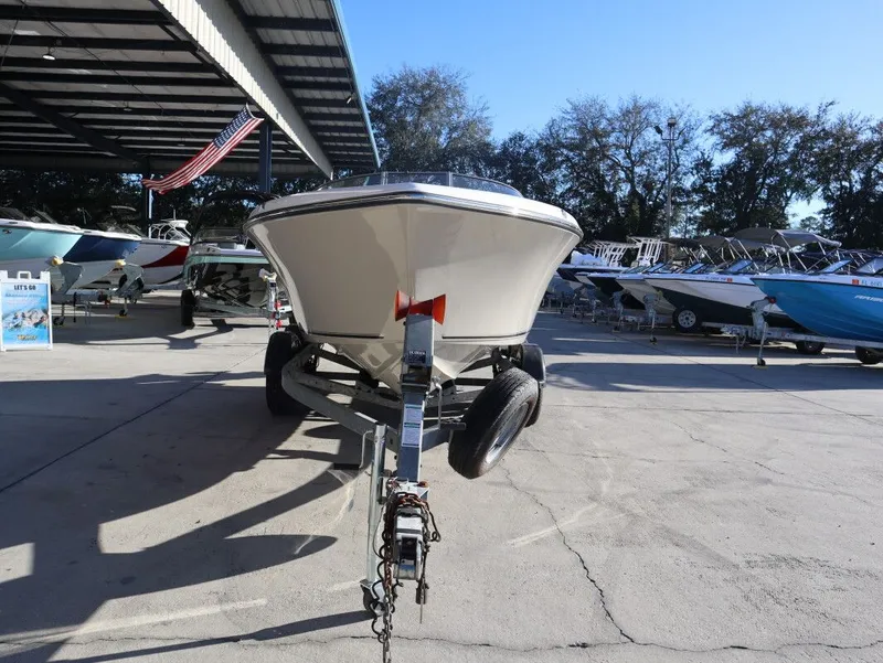 Slide: The Image of Key West 203 DFS boat on trailer displayed outdoors. - 3