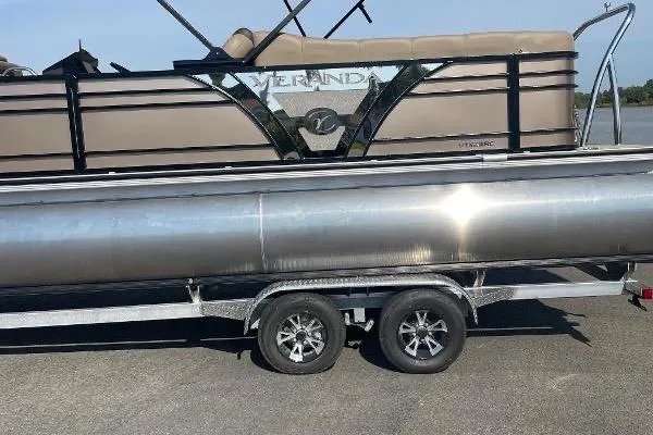 Slide: The Image of 2024 Veranda VTX 22RC pontoon boat on a trailer, side view. - 10