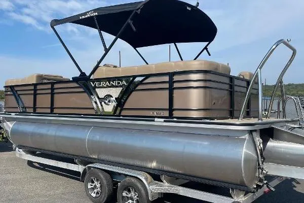 Slide: The Image of 2024 Veranda VTX 22RC pontoon boat on trailer with canopy, side view. - 3