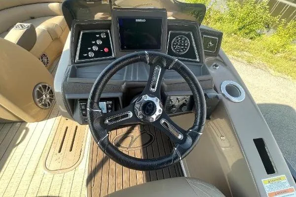 Slide: The Image of 2024 Veranda VTX 22RC boat dashboard with steering wheel and control panel. - 4