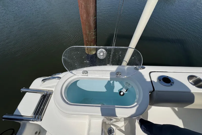 Slide: The Image of 2022 Key West 244 Center Console boat with open livewell on deck. - 15