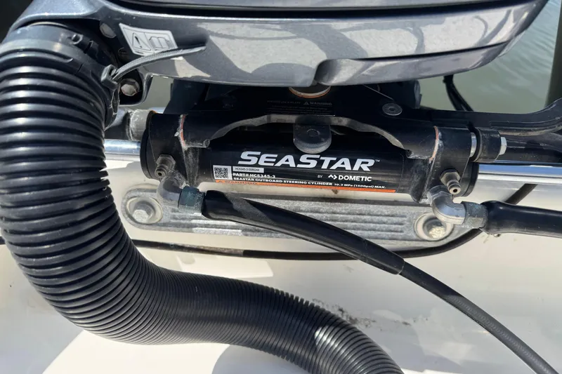 Slide: The Image of Close-up of SeaStar hydraulic steering system on 2022 Key West 244 Center Console boat. - 17