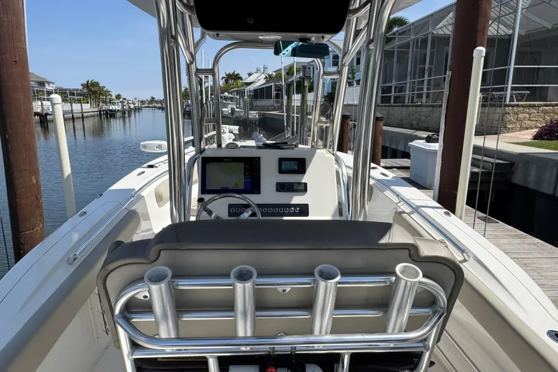 Slide: The Image of 2022 Key West 244 Center Console boat docked, featuring modern navigation equipment. - 18