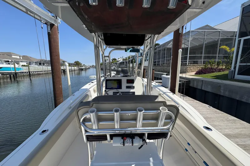 Slide: The Image of 2022 Key West 244 Center Console boat docked in a marina, interior view. - 19