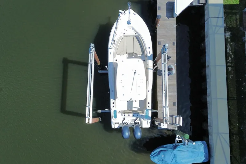 Slide: The Image of Overhead view of 2022 Key West 244 Center Console boat docked at a pier. - 2