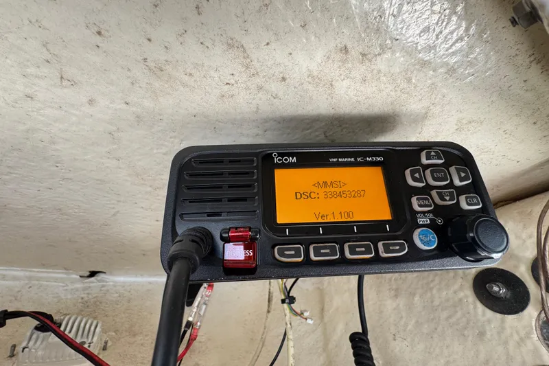 Slide: The Image of VHF marine radio on 2022 Key West 244 Center Console boat, displaying MMSI and DSC information. - 28