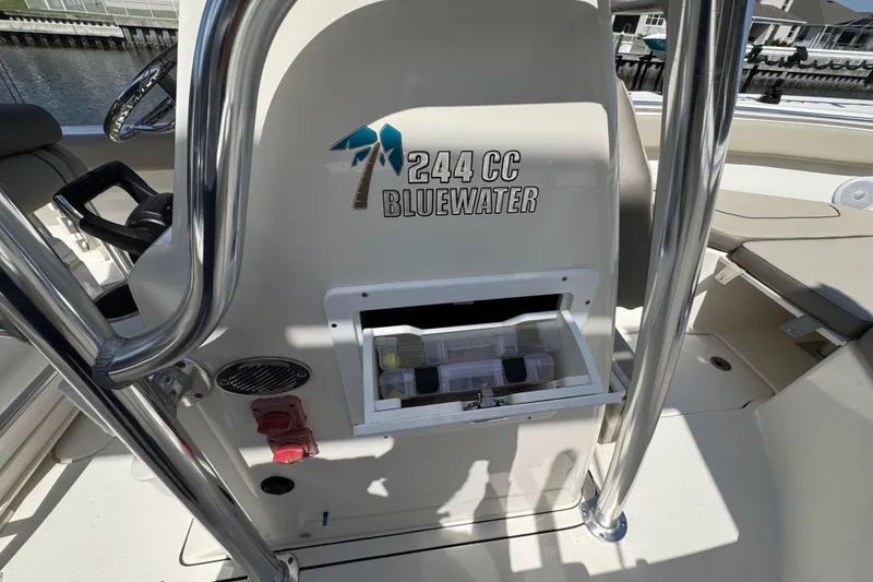 Slide: The Image of 2022 Key West 244 Center Console boat interior with storage compartment open. - 34
