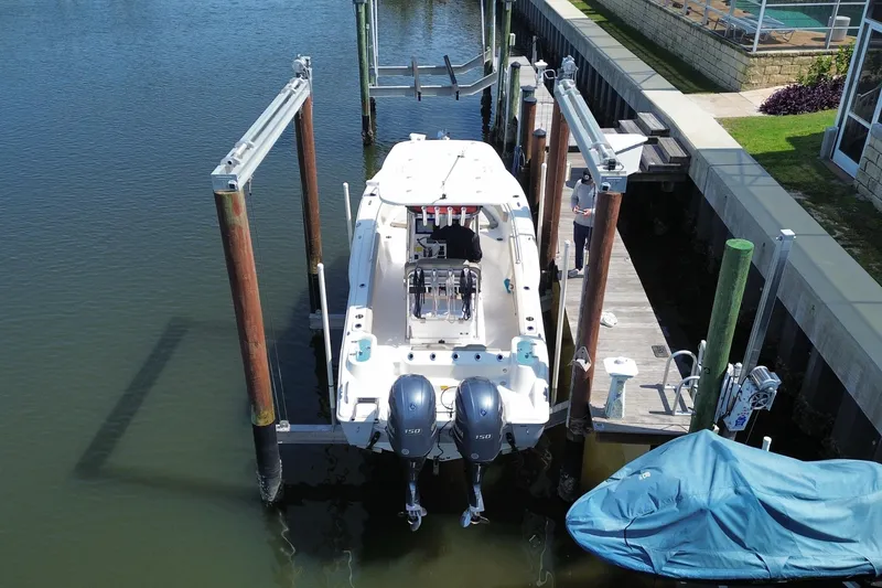 Slide: The Image of 2022 Key West 244 Center Console boat docked with dual engines. - 4