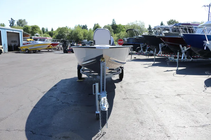 Slide: The Image of 2025 Smoker Craft Angler 16 XL TL boat on trailer in outdoor lot. - 3