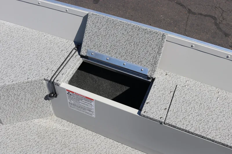 Slide: The Image of Open storage compartment on 2025 Smoker Craft Angler 16 XL TL boat. - 8