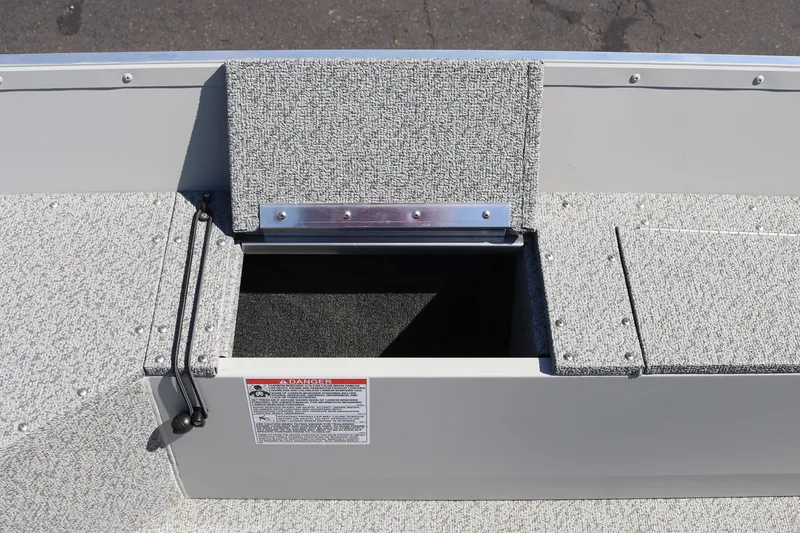 Slide: The Image of 2025 Smoker Craft Angler 16 XL TL boat storage compartment with open hatch. - 9