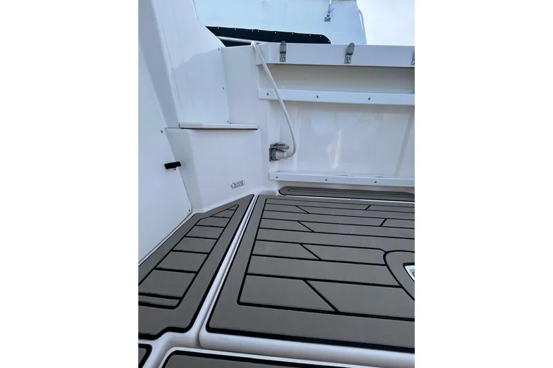 Slide: The Image of 2024 Cutwater C-288 Coupe boat deck with sleek, modern design and durable flooring. - 11