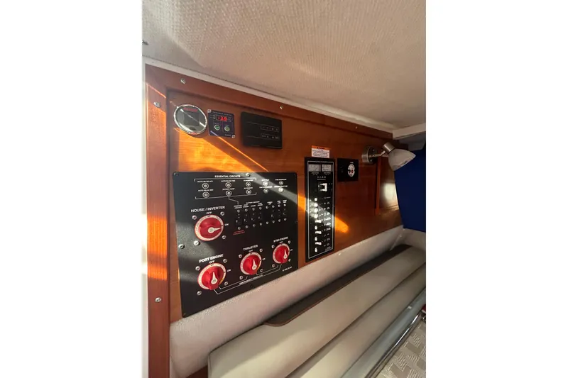 Slide: The Image of 2024 Cutwater C-288 Coupe control panel with switches and gauges in cabin interior. - 20