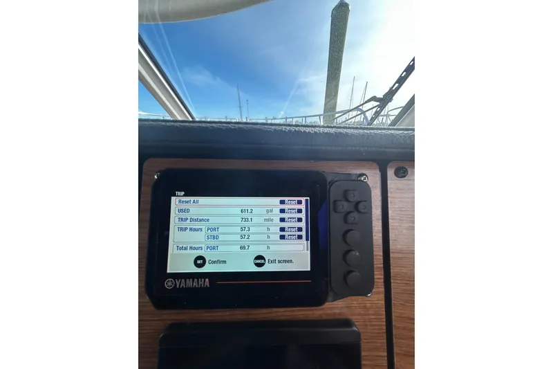 Slide: The Image of Yamaha display on 2024 Cutwater C-288 Coupe showing trip data and fuel usage. - 32