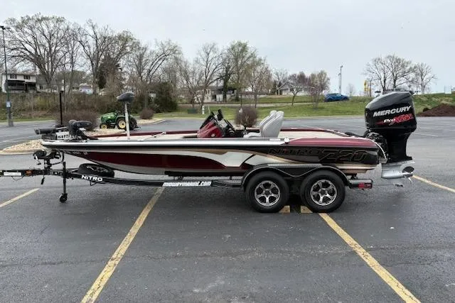 Slide: The Image of 2016 Nitro Z20 fishing boat with trailer in a parking lot. - 10