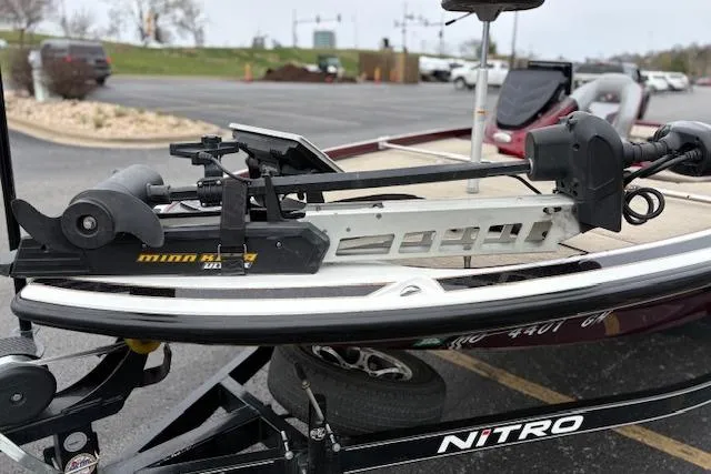 Slide: The Image of Nitro Z20 2016 boat with Minn Kota trolling motor on trailer in parking lot. - 12