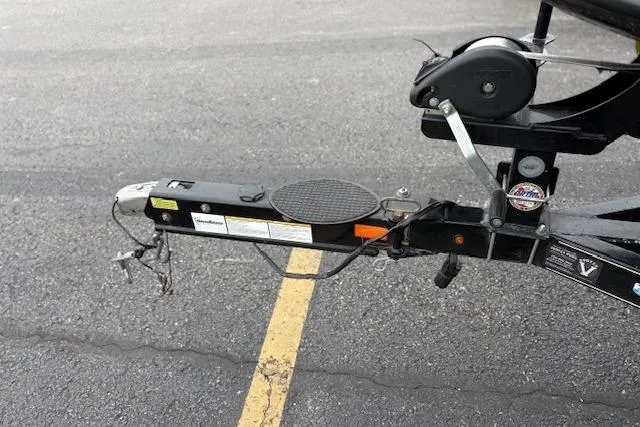 Slide: The Image of Trailer hitch of a 2016 Nitro Z20 boat on asphalt parking lot. - 18