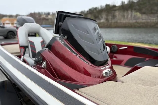 Slide: The Image of 2016 Nitro Z20 boat with sleek red design and comfortable seating by the water. - 19