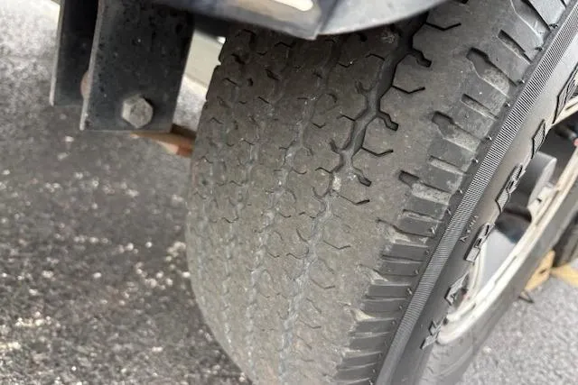 Slide: The Image of Close-up of a worn tire on a 2016 Nitro Z20 vehicle. - 22