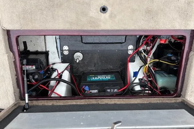 Slide: The Image of 2016 Nitro Z20 boat battery compartment with wiring and components. - 31