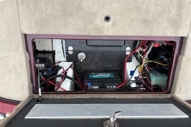 Slide: The Image of 2016 Nitro Z20 boat battery compartment with wiring and components. - 32