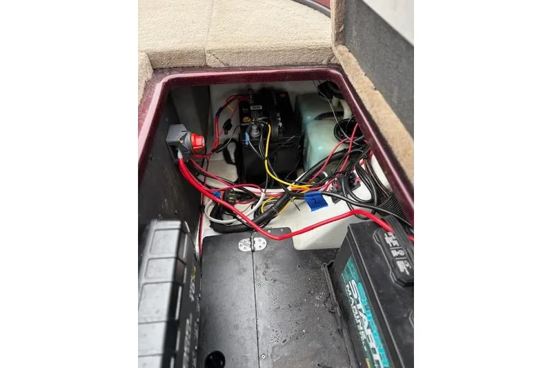 Slide: The Image of 2016 Nitro Z20 boat battery compartment with wiring and components. - 34