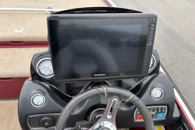 Slide: The Image of Steering console of a 2016 Nitro Z20 boat with Garmin display and gauges. - 39
