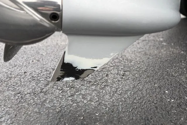 Slide: The Image of Close-up of a 2016 Nitro Z20 boat propeller on asphalt surface. - 47