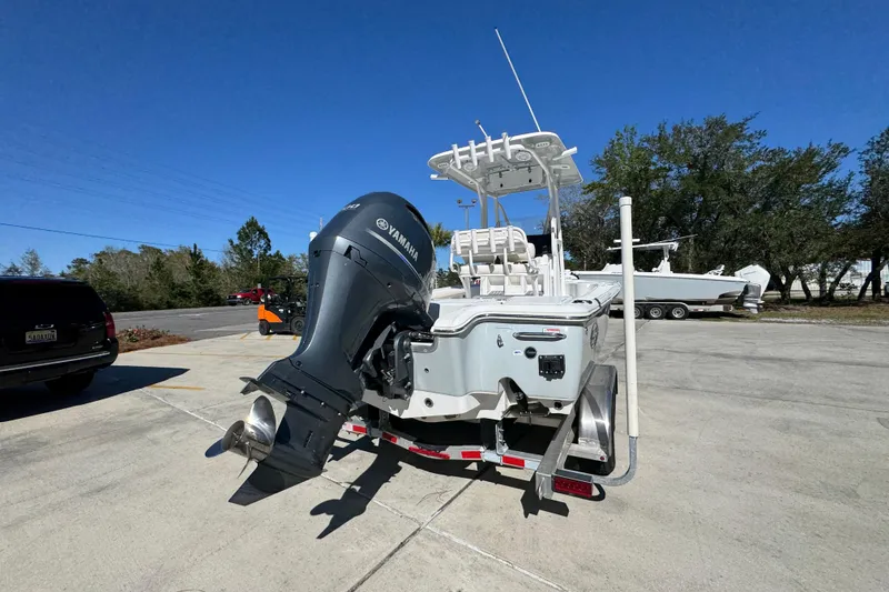 Slide: The Image of 2023 Sea Hunt BX 22 BR boat with Yamaha outboard motor on trailer. - 13