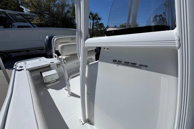 Slide: The Image of 2023 Sea Hunt BX 22 BR boat interior with seating and console details. - 26