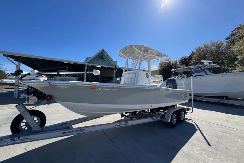 Slide: The Image of 2023 Sea Hunt BX 22 BR boat on trailer under clear blue sky. - 3