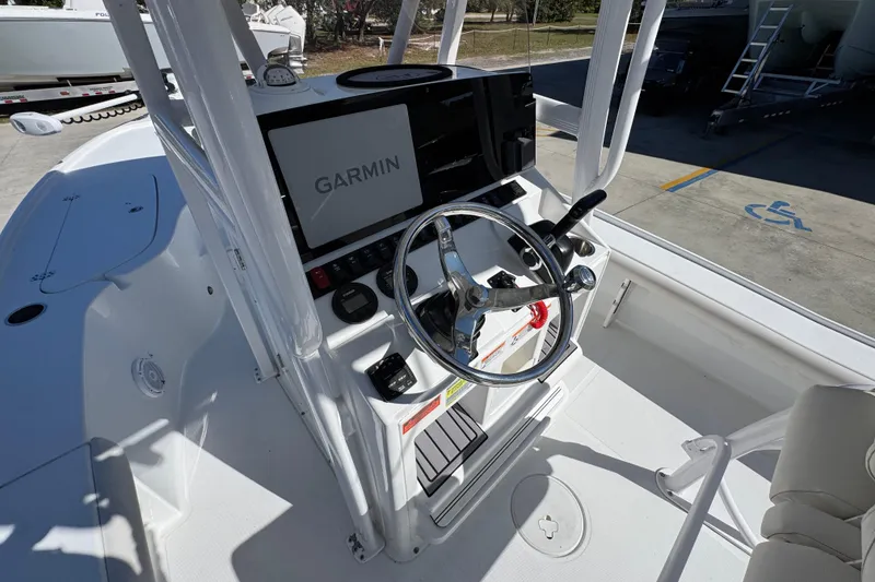 Slide: The Image of 2023 Sea Hunt BX 22 BR boat console with Garmin navigation system and steering wheel. - 31