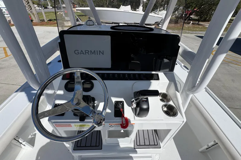 Slide: The Image of 2023 Sea Hunt BX 22 BR boat console with Garmin navigation system and steering wheel. - 32
