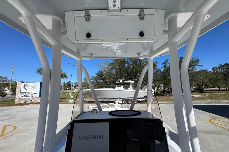 Slide: The Image of 2023 Sea Hunt BX 22 BR boat with Garmin navigation, parked outdoors at Grander Marine. - 33