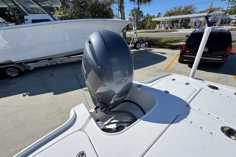Slide: The Image of 2023 Sea Hunt BX 22 BR boat with Yamaha outboard motor in parking lot. - 39