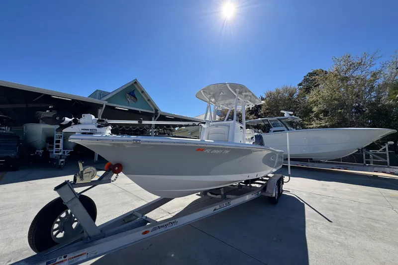 Slide: The Image of 2023 Sea Hunt BX 22 BR boat on trailer under clear blue sky. - 4