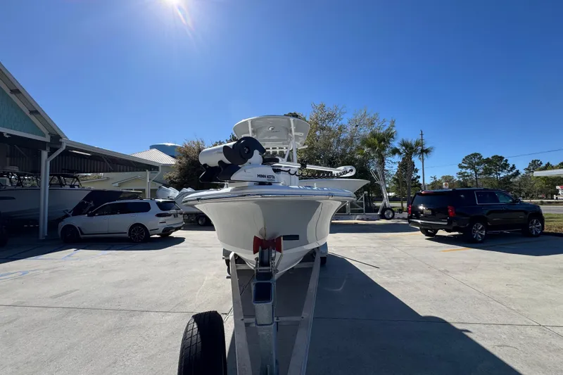 Slide: The Image of 2023 Sea Hunt BX 22 BR boat on trailer under clear blue sky. - 6