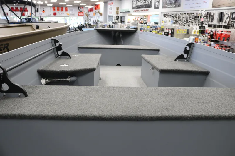 Slide: The Image of 2025 Smoker Craft Big Fisherman 14 boat interior with seating and storage compartments. - 5