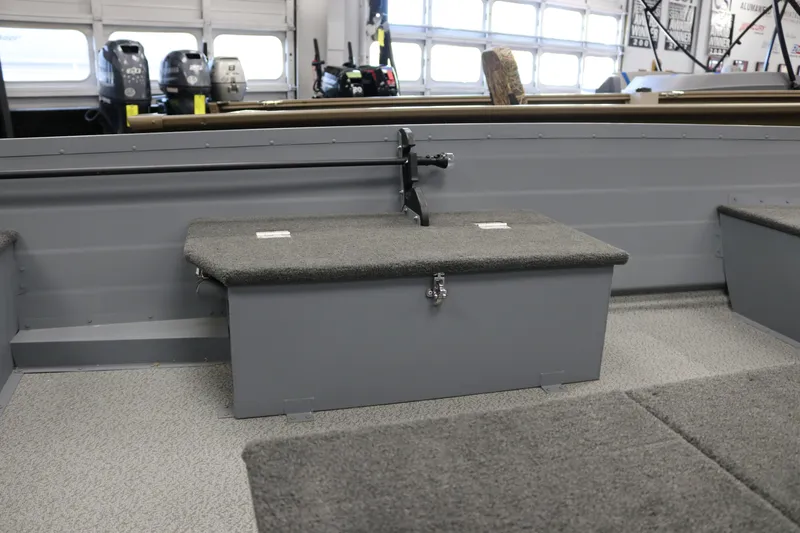 Slide: The Image of Interior of 2025 Smoker Craft Big Fisherman 14 boat, featuring seating and storage. - 6