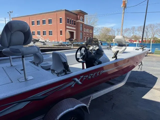 Slide: The Image of 2019 Xpress XP 200 Catfish boat in front of brick building. - 4