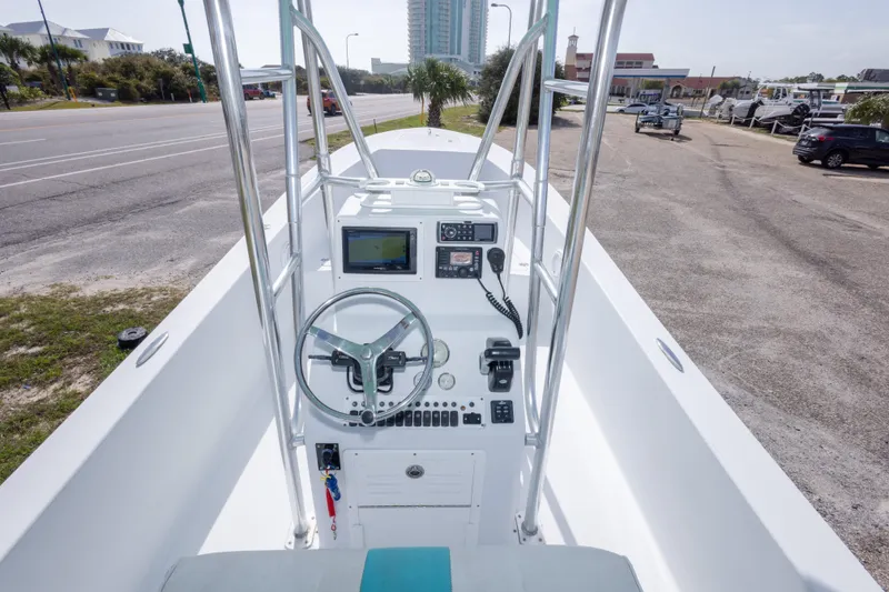 Slide: The Image of 2007 Andros Cuda 23 boat console with steering wheel and navigation equipment. - 17
