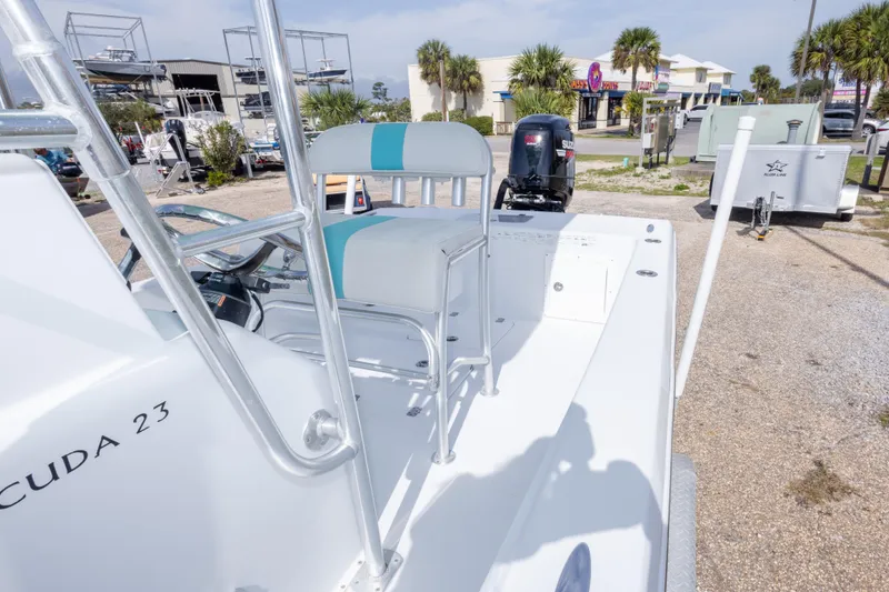 Slide: The Image of 2007 Andros Cuda 23 boat with seating, parked outdoors. - 20
