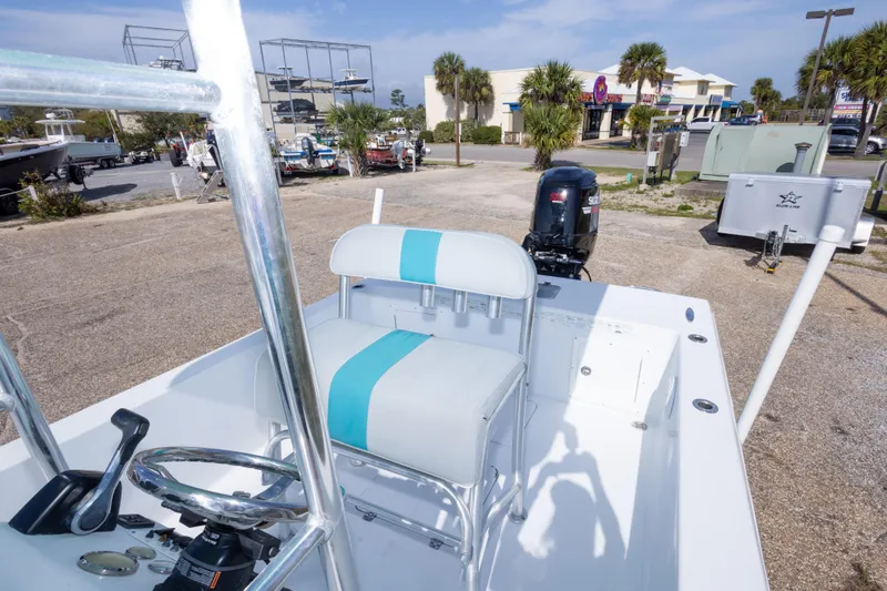 Slide: The Image of 2007 Andros Cuda 23 boat with Suzuki outboard motor in a marina setting. - 22