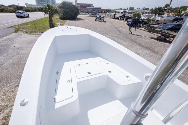 Slide: The Image of 2007 Andros Cuda 23 boat on trailer, parked near road and marina. - 28