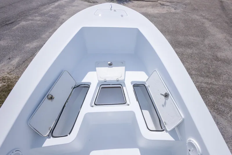 Slide: The Image of 2007 Andros Cuda 23 boat deck with open storage compartments. - 31