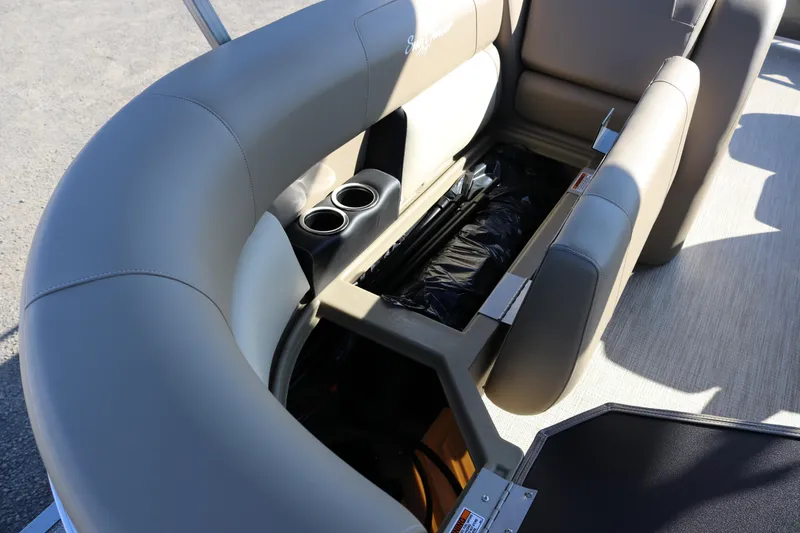 Slide: The Image of 2025 SunChaser Vista 18 Fish boat interior with storage compartment and cup holders. - 11