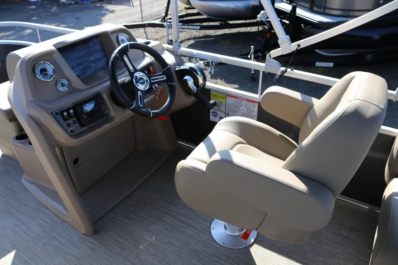 Slide: The Image of 2025 SunChaser Vista 18 Fish boat interior with steering console and captain's chair. - 17