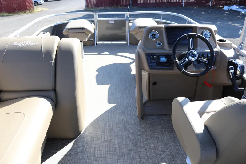 Slide: The Image of 2025 SunChaser Vista 18 Fish boat interior with steering console and seating. - 3